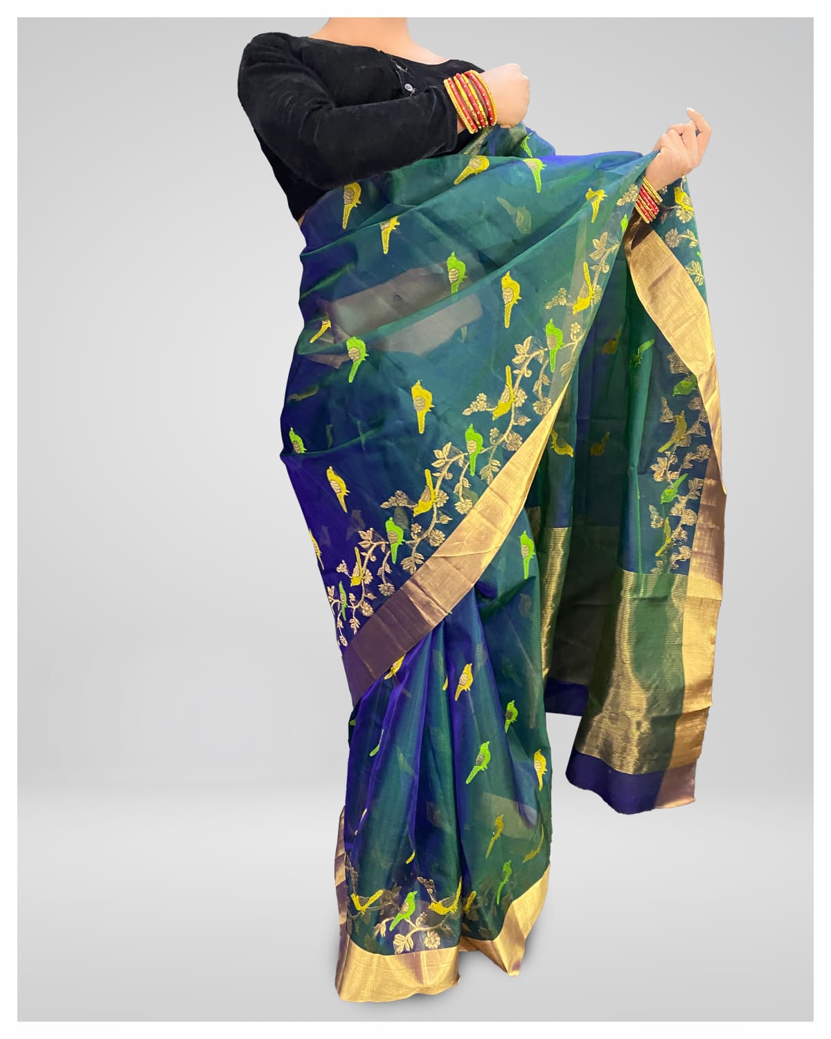 Elegant Peacock Green Silk Saree with Golden Detailing